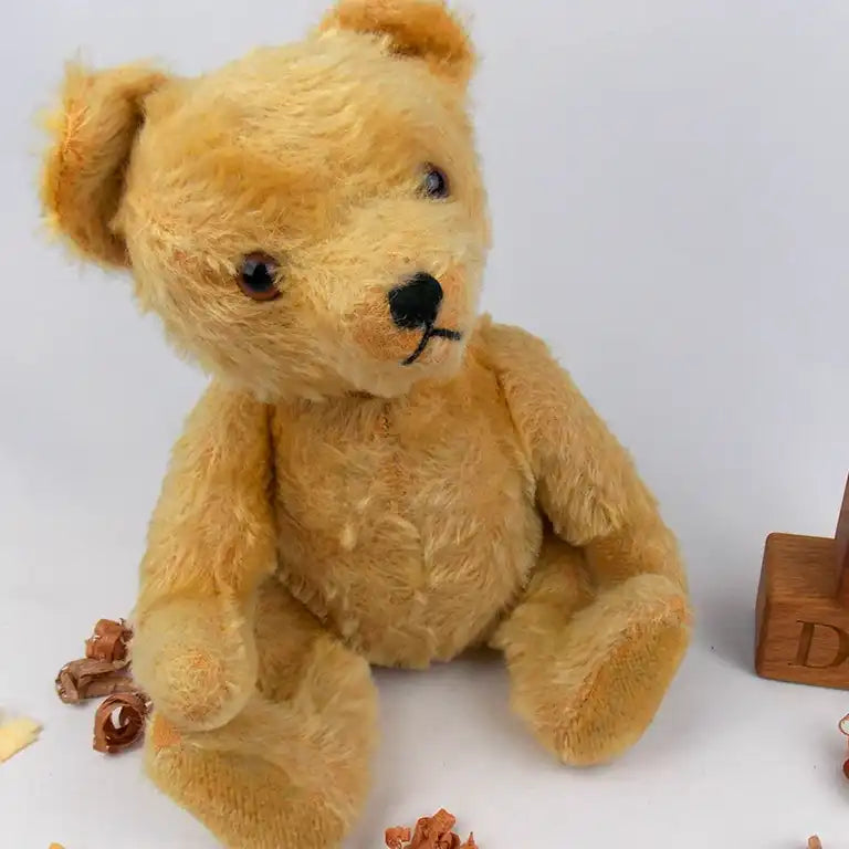 Teddy bear sitting on the floor