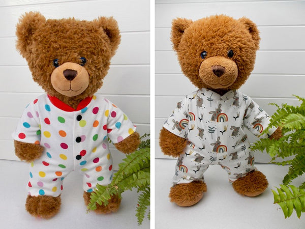 Two teddy bears wearing sleepsuits