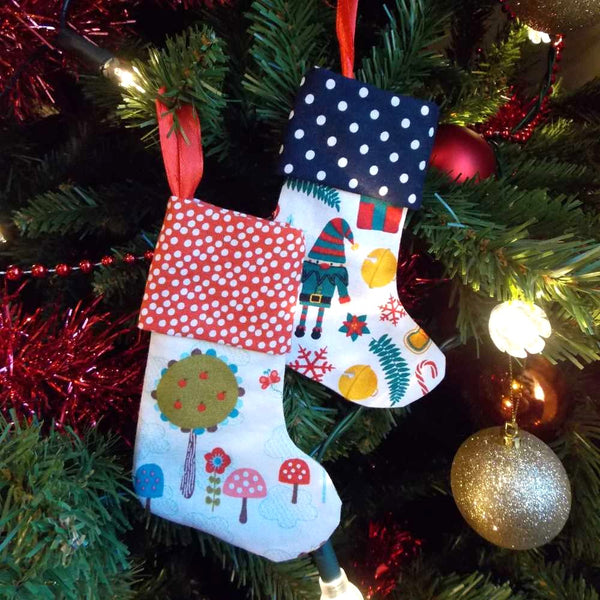 Two mini Christmas stockings on the Christmas tree