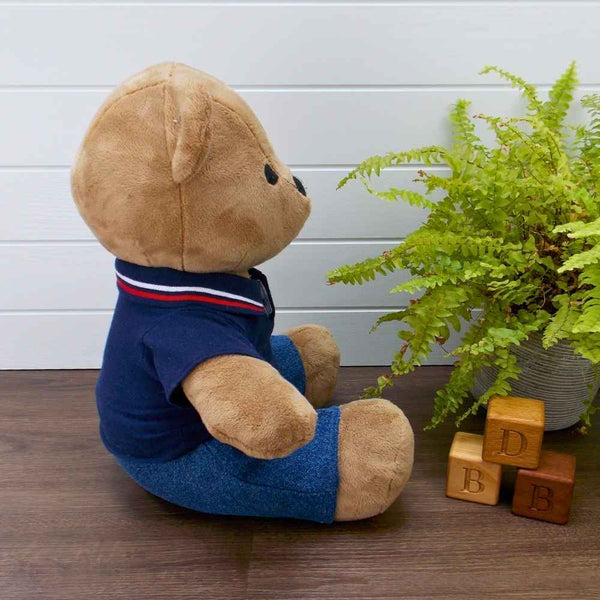 Funky Friends Factory Melody Bear wearing blue denim jeans and a blue polo t-shirt with a red & white strip on the collar